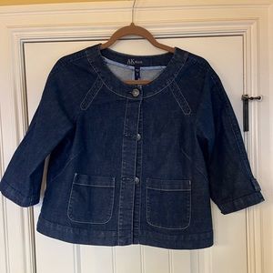 Women’s AK Jean jacket with 3/4 sleeves and pleat in back.